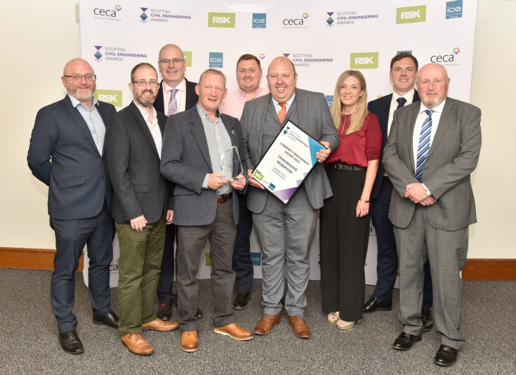 The George Leslie team alongside Scottish Water staff holding the award